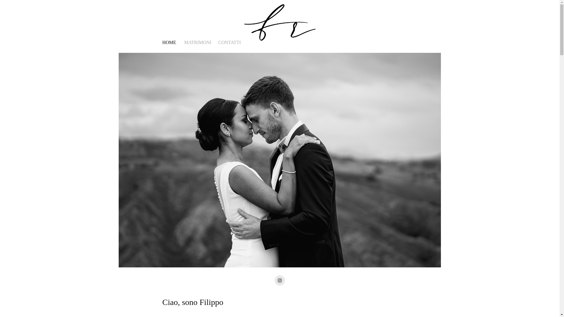 website screenshot of https://filipporeviatifotografo.it/