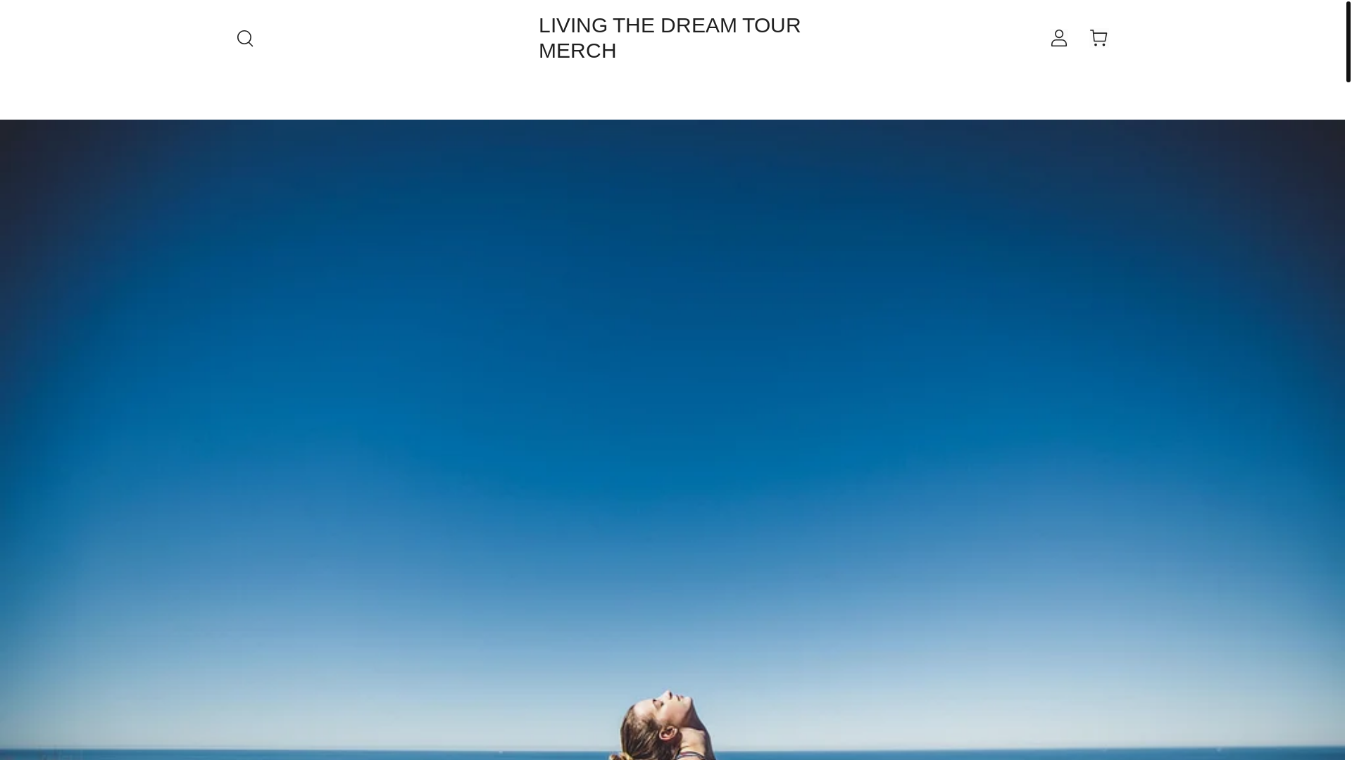 website screenshot of https://livingthedreamtourmerch.com/