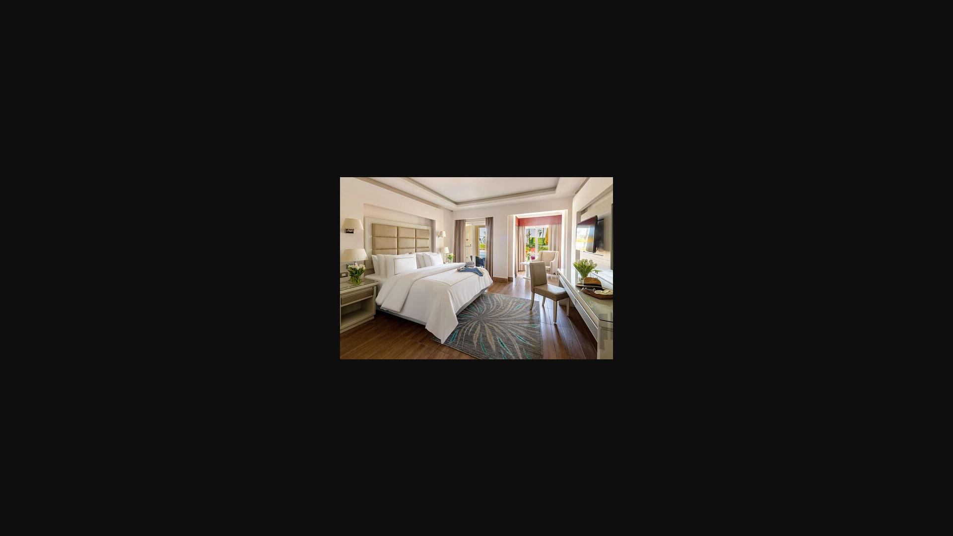 website screenshot of https://media-cdn.tripadvisor.com/media/photo-s/2e/54/70/c9/guest-room.jpg