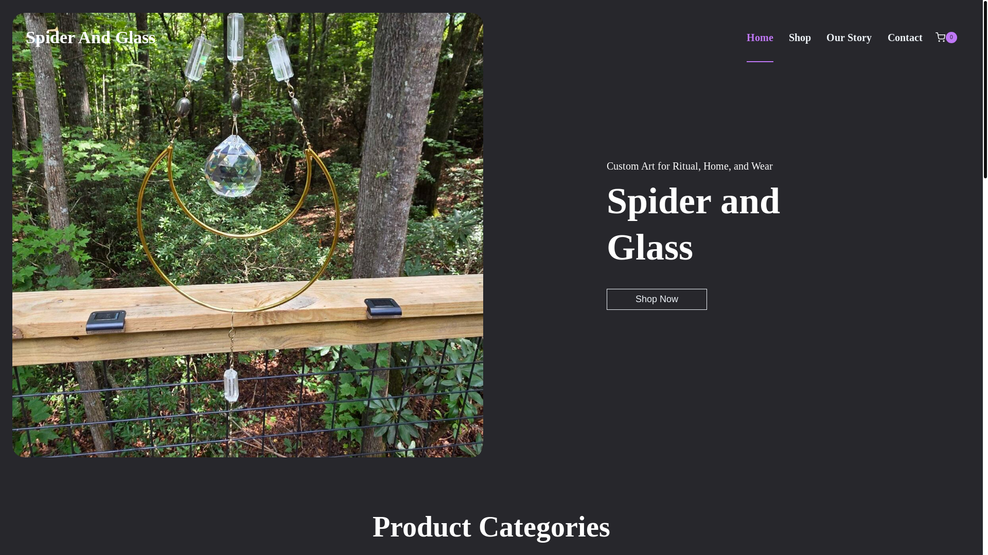 website screenshot of https://spiderandglass.com/